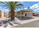 Inviting single-story home with a covered carport and well-maintained gravel landscaping at 7807 E Main St # Cc-71, Mesa, AZ 85207
