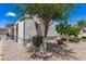 Home featuring mature citrus trees and rock landscaping at 7807 E Main St # Cc-71, Mesa, AZ 85207
