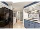 View of open kitchen with black refrigerator and stainless steel appliances at 7807 E Main St # Cc-71, Mesa, AZ 85207