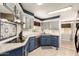 Modern kitchen features stainless steel appliances, granite countertops, and tile backsplash at 7807 E Main St # Cc-71, Mesa, AZ 85207