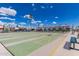 Shuffleboard courts with vibrant green surfaces and clearly marked numbers, perfect for outdoor community recreation at 7807 E Main St # Cc-71, Mesa, AZ 85207