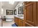 Bathroom featuring a bathtub, double sink vanity, and natural lighting at 8111 E 5Th Ave, Mesa, AZ 85208