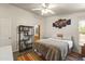 Bright bedroom featuring a bed and decorations, with wood-look flooring at 8111 E 5Th Ave, Mesa, AZ 85208