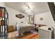 Bedroom with a ceiling fan, modern decor, and warm natural lighting at 8111 E 5Th Ave, Mesa, AZ 85208