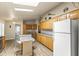 Kitchen featuring matching appliances, an island with seating and natural lighting at 8111 E 5Th Ave, Mesa, AZ 85208