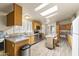 Well-lit kitchen featuring stainless steel appliances and light wood cabinetry at 8111 E 5Th Ave, Mesa, AZ 85208