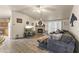 Comfortable living room features a stone fireplace and wood-look flooring at 8111 E 5Th Ave, Mesa, AZ 85208
