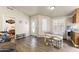 Open concept living and dining area with natural light and wood floors at 8111 E 5Th Ave, Mesa, AZ 85208