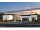 Modern home featuring stone accents, a two-car garage, and beautiful landscaping at 8300 E Dixileta Dr # 306, Scottsdale, AZ 85266