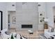 Living room boasts a modern fireplace, art, and comfortable seating area at 8300 E Dixileta Dr # 306, Scottsdale, AZ 85266