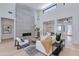 Bright living room with soaring ceilings, a modern fireplace, and open floor plan at 8300 E Dixileta Dr # 306, Scottsdale, AZ 85266