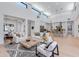 Open-concept living room with high ceilings connecting to kitchen and dining area at 8300 E Dixileta Dr # 306, Scottsdale, AZ 85266