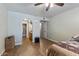 Bedroom featuring wood flooring, a ceiling fan, and an ensuite bathroom at 839 S Westwood -- # 154, Mesa, AZ 85210