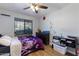 Cozy bedroom with a ceiling fan, a window with blinds, and a comfortable bed at 839 S Westwood -- # 154, Mesa, AZ 85210
