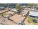 Aerial view of property with a spacious dirt backyard and perimeter walls at 875 E Flint St, Chandler, AZ 85225