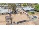 Aerial view of property with a spacious dirt backyard and perimeter walls at 875 E Flint St, Chandler, AZ 85225