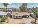 Aerial view of a single-story home with a large, covered parking area and desert landscaping at 875 E Flint St, Chandler, AZ 85225