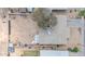 Aerial view of house roof and spacious dirt backyard surrounded by a perimeter wall at 875 E Flint St, Chandler, AZ 85225
