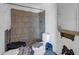 Dilapidated bathroom with tiled shower, toilet, and damaged walls at 875 E Flint St, Chandler, AZ 85225