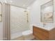 Modern bathroom with walk-in shower featuring gold fixtures and a marble vanity at 875 E Flint St, Chandler, AZ 85225