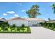 Charming single-story home with a well-manicured front yard and a long driveway at 875 E Flint St, Chandler, AZ 85225