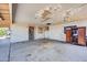 Spacious garage with cement floors and textured walls at 875 E Flint St, Chandler, AZ 85225