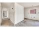 Hallway with unfinished drywall, concrete floors and access to other areas of the house at 875 E Flint St, Chandler, AZ 85225