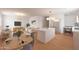 Open-concept living space featuring modern decor, kitchen island, and stainless steel appliances at 875 E Flint St, Chandler, AZ 85225