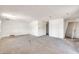 Open living room featuring unfinished drywall, concrete floors and natural light from window at 875 E Flint St, Chandler, AZ 85225