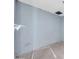 Empty room with blue painted wall and uncovered ceiling fixture at 875 E Flint St, Chandler, AZ 85225