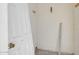Unfinished room with a white door laying against the wall with brass hardware at 875 E Flint St, Chandler, AZ 85225
