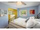 Bedroom with natural light, ceiling fan and a partial view of walk in closet at 901 E Hearn Rd, Phoenix, AZ 85022