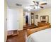 Bedroom with a step up to a closet and a dresser with a mirror and wood flooring at 901 E Hearn Rd, Phoenix, AZ 85022
