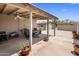 The covered patio features a ceiling fan and a seating area, enhancing outdoor comfort and enjoyment at 901 E Hearn Rd, Phoenix, AZ 85022