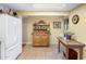 Bright kitchen with white appliances, adjacent to an open dining area with natural light at 901 E Hearn Rd, Phoenix, AZ 85022