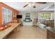 Comfortable living space with tile floors, fireplace, rocking chairs, and a bright, airy ambiance at 901 E Hearn Rd, Phoenix, AZ 85022