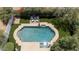 Aerial view of the swimming pool and spa complemented by well-maintained landscaping and outdoor seating at 921 W Willetta St, Phoenix, AZ 85007