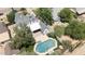 Aerial view of property showcasing a large pool, well-manicured landscaping, and a detached garage at 921 W Willetta St, Phoenix, AZ 85007