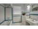Classic bathroom with vintage-style tile work, a dresser, and traditional fixtures at 921 W Willetta St, Phoenix, AZ 85007