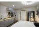 Bedroom featuring a kitchenette, zebra art, modern light fixture and spiral staircase at 921 W Willetta St, Phoenix, AZ 85007
