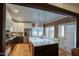 Modern kitchen with white cabinets, marble counters, stainless steel appliances, and a large island at 921 W Willetta St, Phoenix, AZ 85007