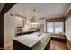 Bright kitchen showcasing a marble island, stainless steel appliances, and a cozy window seat at 921 W Willetta St, Phoenix, AZ 85007