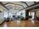 Spacious living room boasts hardwood floors, exposed beams, and a fireplace with a custom mantle at 921 W Willetta St, Phoenix, AZ 85007