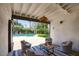 Outdoor patio with comfortable seating area and view of the pool at 921 W Willetta St, Phoenix, AZ 85007
