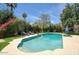 Inviting backyard pool area with lush landscaping and sunny skies at 921 W Willetta St, Phoenix, AZ 85007