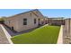 Large backyard with artificial grass, perfect for relaxation and outdoor activities at 94 S 189Th Ln, Buckeye, AZ 85326
