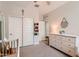 Neutral Bedroom with gray carpet, white dresser and closet doors, and tasteful wall decorations at 94 S 189Th Ln, Buckeye, AZ 85326