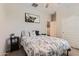 Cozy bedroom features double bed, black nightstand and decorative artwork at 94 S 189Th Ln, Buckeye, AZ 85326
