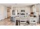Bright kitchen features stainless steel appliances and eat-in breakfast bar overlooking the dining area at 94 S 189Th Ln, Buckeye, AZ 85326