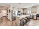 Modern kitchen with stainless steel appliances, quartz countertops, and wood-look tile floors at 94 S 189Th Ln, Buckeye, AZ 85326